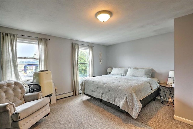 25 Sharon St Unit 1, Cranston, RI 02910 - bedroom with light colored carpet and baseboard heating