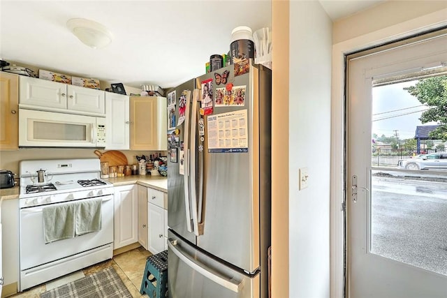 25 Sharon St Unit 1, Cranston, RI 02910 - kitchen with white appliances, light countertops, and white cabinetry