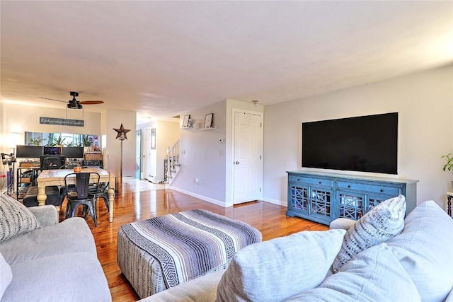 25 Sharon St Unit 1, Cranston, RI 02910 - living room with wood finished floors, ceiling fan, and stairs