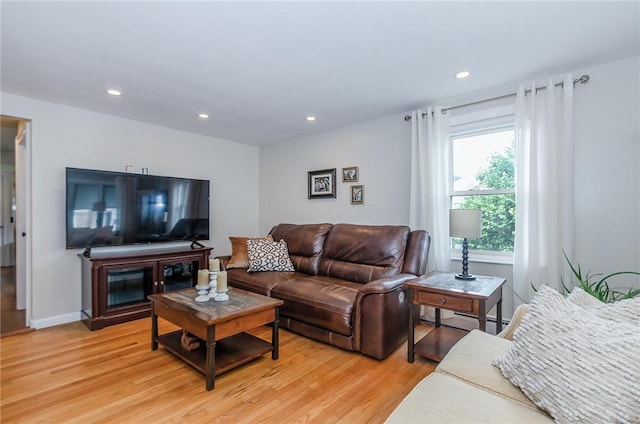 75 Columbus St, Providence, RI 02908 - living room with light wood finished floors, recessed lighting, and a baseboard heating unit