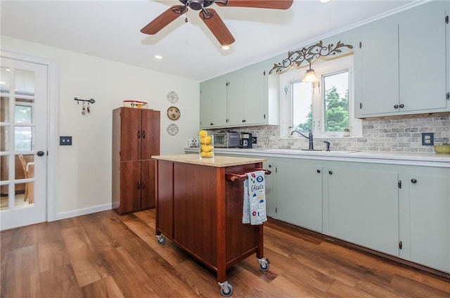 75 Columbus St, Providence, RI 02908 - kitchen with tasteful backsplash, light countertops, dark wood-type flooring, a ceiling fan, and recessed lighting