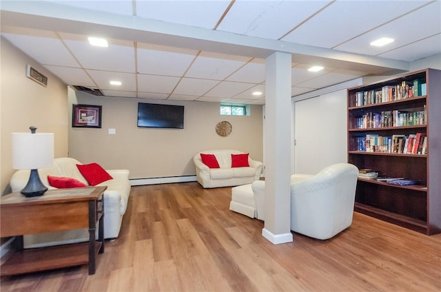 75 Columbus St, Providence, RI 02908 - living room featuring light wood finished floors, a baseboard heating unit, a paneled ceiling, and recessed lighting