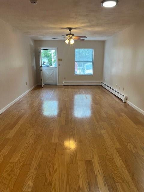 444 Woodward Rd Unit 3, North Providence, RI 02904 - unfurnished room featuring ceiling fan, wood finished floors, and a baseboard radiator