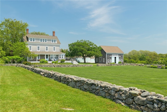 68 Grange Ave, Little Compton, RI 02837 - view of grassy yard featuring an outdoor structure and covered porch