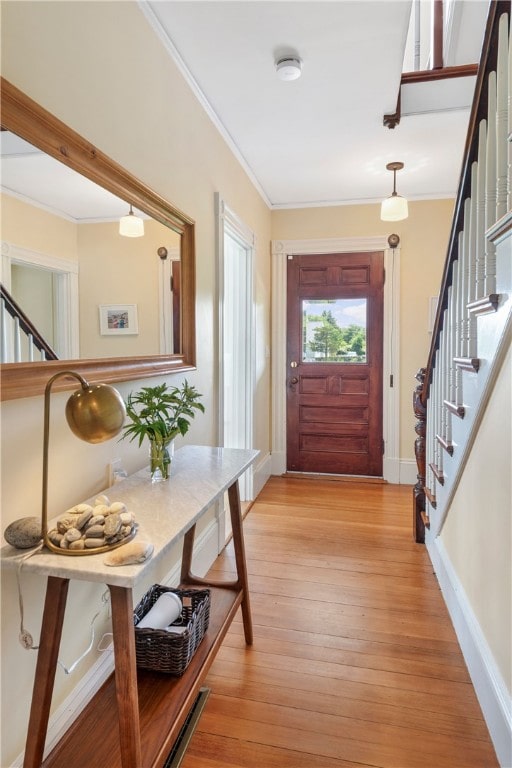 68 Grange Ave, Little Compton, RI 02837 - foyer entrance featuring stairs, crown molding, and light wood-type flooring