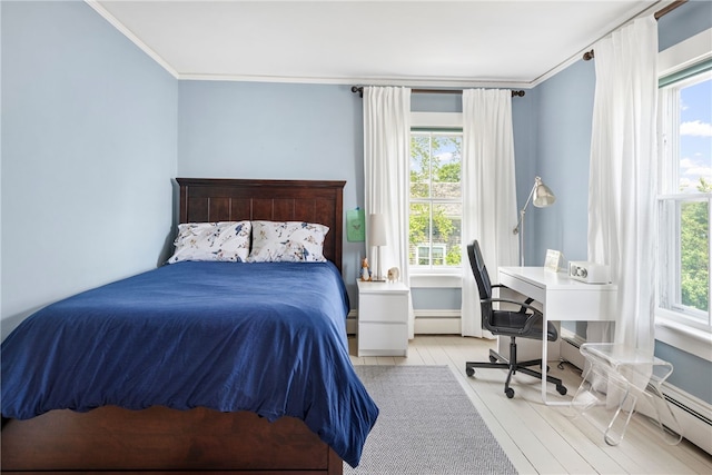 68 Grange Ave, Little Compton, RI 02837 - bedroom featuring multiple windows, wood finished floors, crown molding, a desk, and a baseboard heating unit