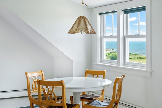 68 Grange Ave, Little Compton, RI 02837 - dining room featuring plenty of natural light, a water view, and a baseboard radiator