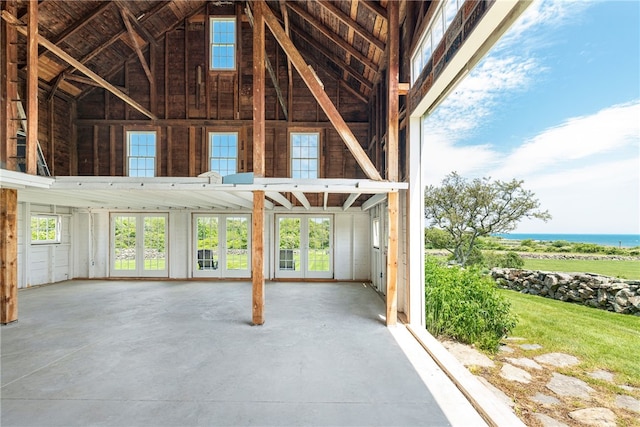 68 Grange Ave, Little Compton, RI 02837 - miscellaneous room with high vaulted ceiling and concrete flooring