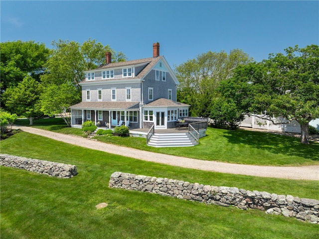 68 Grange Ave, Little Compton, RI 02837 - shingle-style home featuring a chimney, a front lawn, and covered porch