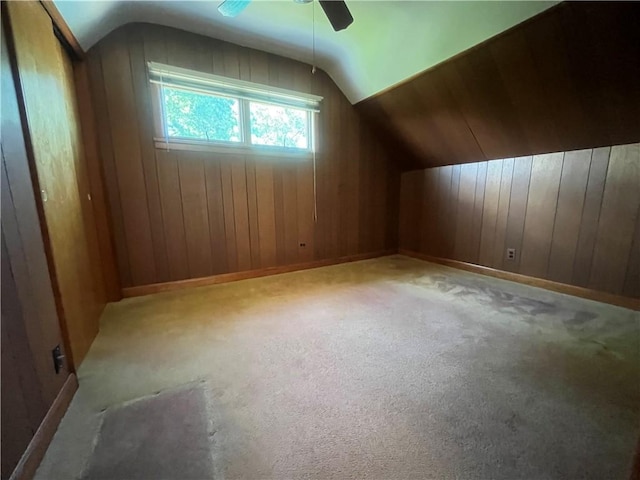 16 Winthrop St, Cranston, RI 02910 - additional living space with lofted ceiling, ceiling fan, wooden walls, and carpet flooring