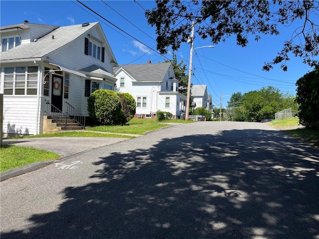 16 Winthrop St, Cranston, RI 02910 - view of asphalt road featuring entry steps and street lighting