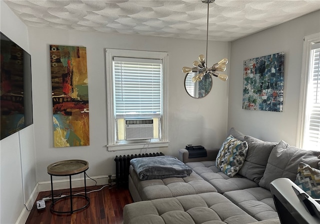 43 Toronto Ave, Providence, RI 02905 - bedroom with wood finished floors, radiator heating unit, cooling unit, and multiple windows