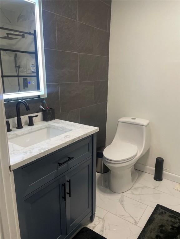 43 Toronto Ave, Providence, RI 02905 - bathroom with marble look tile flooring and vanity