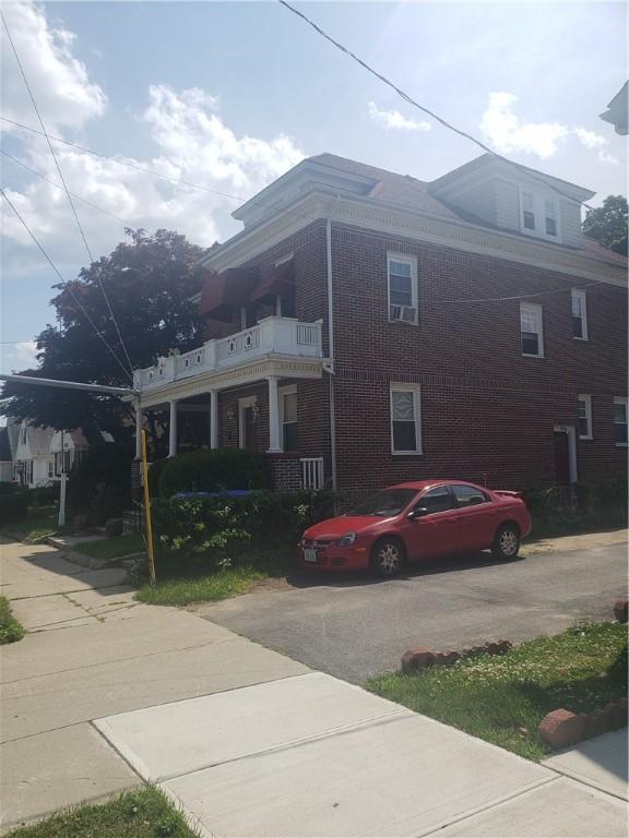 106 Langdon St, Providence, RI 02904 - view of side of home with brick siding