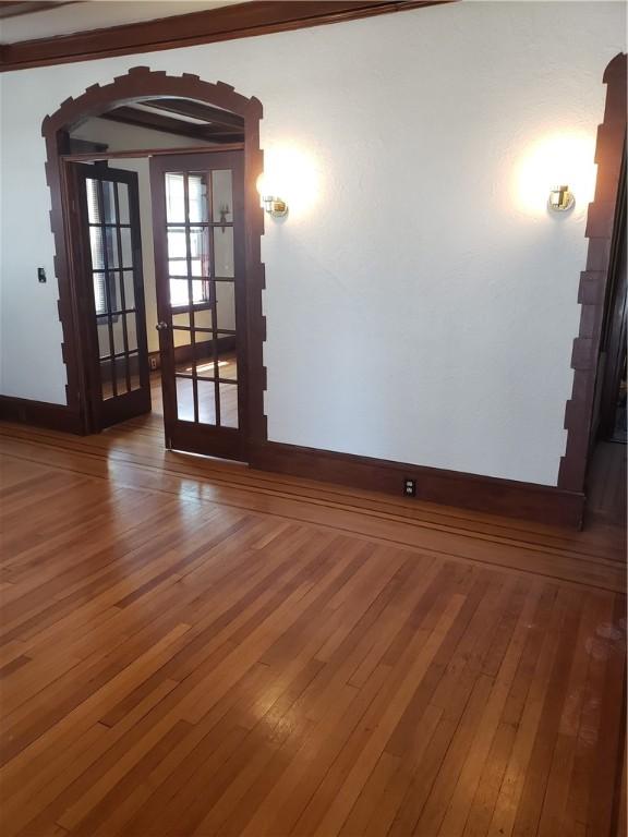 106 Langdon St, Providence, RI 02904 - unfurnished room featuring arched walkways and hardwood / wood-style floors
