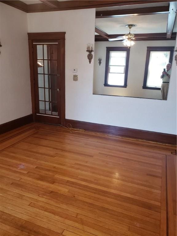106 Langdon St, Providence, RI 02904 - empty room with light wood-style floors, ceiling fan, and beam ceiling