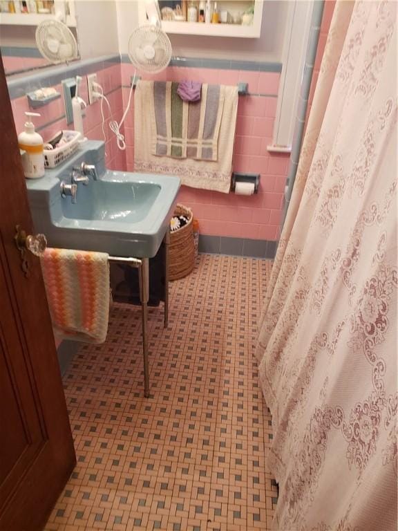 106 Langdon St, Providence, RI 02904 - bathroom with tile walls, wainscoting, and a shower with curtain