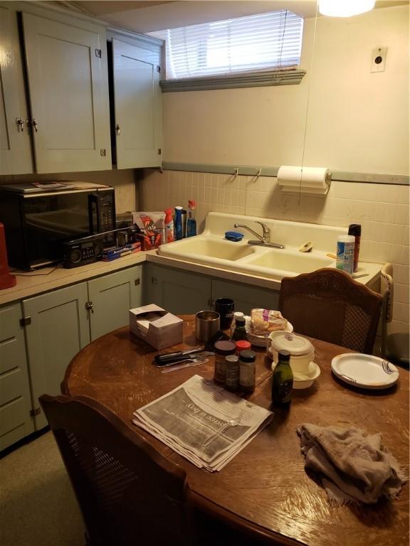 106 Langdon St, Providence, RI 02904 - kitchen with tile walls, wainscoting, and light countertops