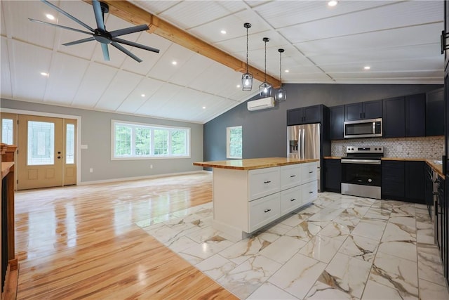 154 Foster Center Rd, Foster, RI 02825 - kitchen with stainless steel appliances, wood counters, open floor plan, decorative backsplash, and a ceiling fan