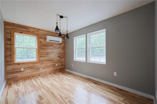 154 Foster Center Rd, Foster, RI 02825 - spare room with a wall mounted AC, wood walls, and wood finished floors