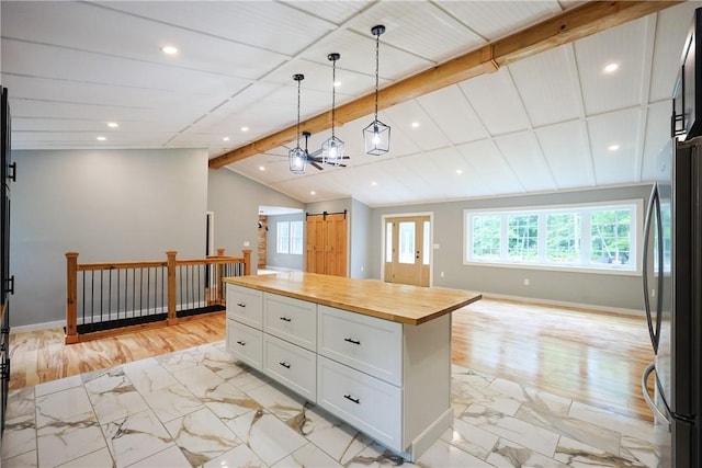 154 Foster Center Rd, Foster, RI 02825 - kitchen with light marble finish flooring, butcher block counters, white cabinetry, freestanding refrigerator, and open floor plan