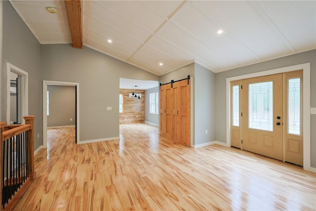 154 Foster Center Rd, Foster, RI 02825 - entryway featuring light wood-style flooring, a barn door, and recessed lighting