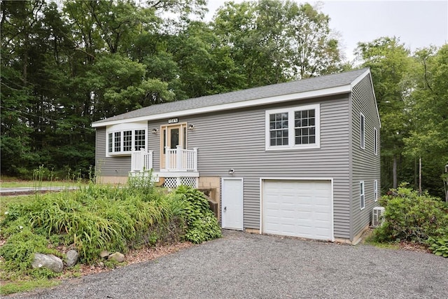 154 Foster Center Rd, Foster, RI 02825 - view of front of house featuring a garage and view of scattered trees