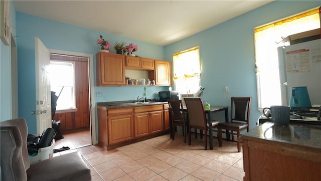 271 Union Ave, Providence, RI 02909 - kitchen featuring light tile patterned floors, dark countertops, and open shelves