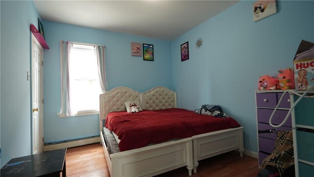 271 Union Ave, Providence, RI 02909 - bedroom with a baseboard radiator and wood finished floors