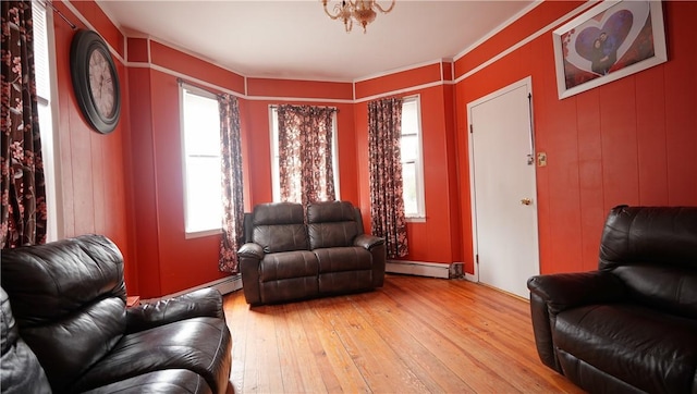 271 Union Ave, Providence, RI 02909 - living room with light wood-style floors and a baseboard heating unit