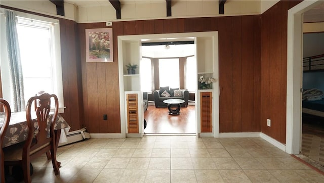 271 Union Ave, Providence, RI 02909 - dining room with wood walls, beamed ceiling, and a baseboard radiator