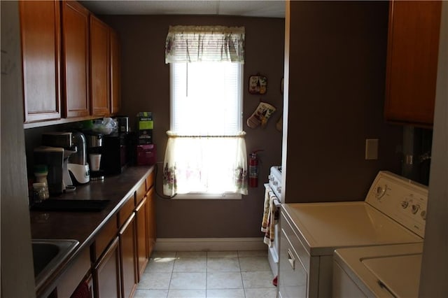 494 Grove St, Woonsocket, RI 02895 - washroom featuring separate washer and dryer and light tile patterned floors