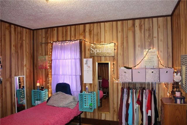 494 Grove St, Woonsocket, RI 02895 - bedroom featuring a textured ceiling, wood walls, and crown molding