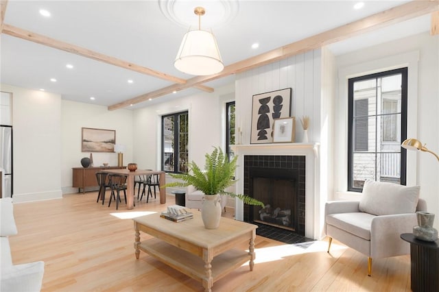 501 Hope St, Providence, RI 02906 - living room featuring light wood finished floors, a fireplace, recessed lighting, and beamed ceiling