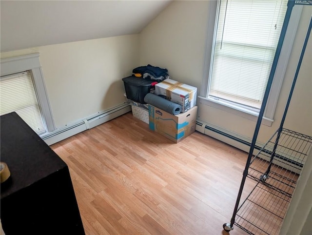 10 Stamford Ave, Providence, RI 02907 - additional living space featuring light wood-style flooring, vaulted ceiling, and a baseboard radiator
