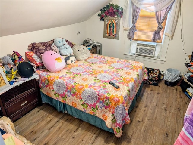 10 Stamford Ave, Providence, RI 02907 - bedroom featuring wood finished floors, vaulted ceiling, and cooling unit