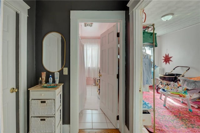 58 Cliffdale Ave, Cranston, RI 02905 - hall with light tile patterned floors and healthy amount of natural light
