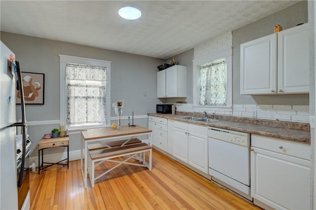 58 Cliffdale Ave, Cranston, RI 02905 - kitchen featuring dishwasher, plenty of natural light, and white cabinetry