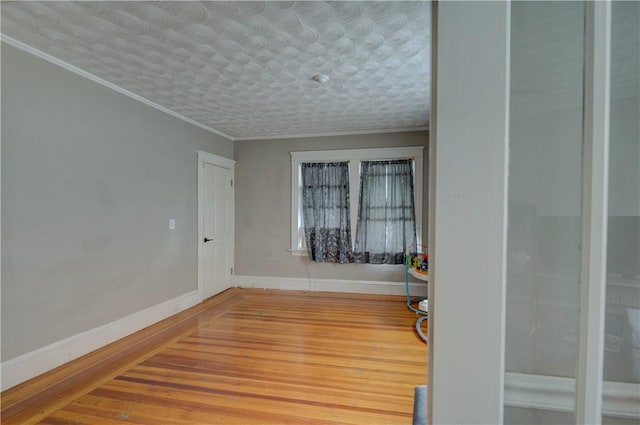58 Cliffdale Ave, Cranston, RI 02905 - empty room with wood finished floors and crown molding