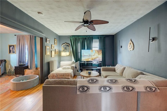 58 Cliffdale Ave, Cranston, RI 02905 - living area featuring wood finished floors, a ceiling fan, and a textured ceiling