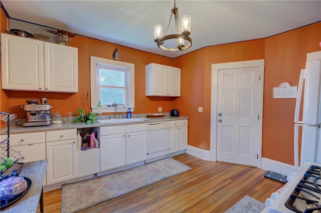 58 Cliffdale Ave, Cranston, RI 02905 - kitchen featuring white appliances, light wood finished floors, a chandelier, and white cabinetry