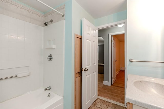40 Lufkin Ct, Warwick, RI 02888 - bathroom featuring vanity, bathing tub / shower combination, a baseboard radiator, and tile patterned flooring