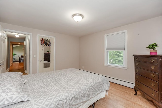 40 Lufkin Ct, Warwick, RI 02888 - bedroom with light wood-style flooring and baseboard heating