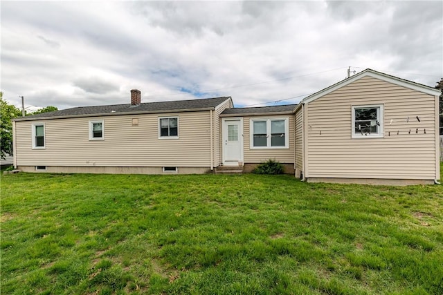40 Lufkin Ct, Warwick, RI 02888 - back of property with entry steps, a lawn, and a chimney