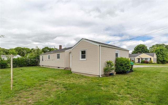 40 Lufkin Ct, Warwick, RI 02888 - view of home's exterior featuring a lawn and a chimney