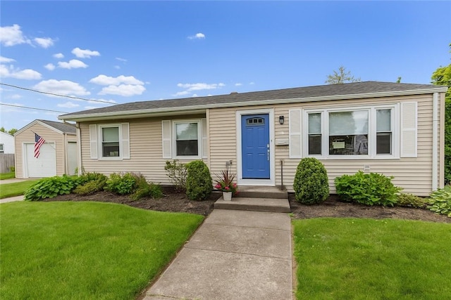 40 Lufkin Ct, Warwick, RI 02888 - view of front facade with a front lawn, an outbuilding, and a garage