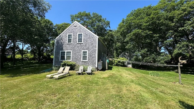 815 Beacon Hill Rd, Block Island, RI 02807 - back of house with a yard and view of scattered trees