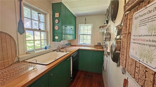 815 Beacon Hill Rd, Block Island, RI 02807 - kitchen featuring green cabinetry, plenty of natural light, wood counters, crown molding, and dark wood-type flooring