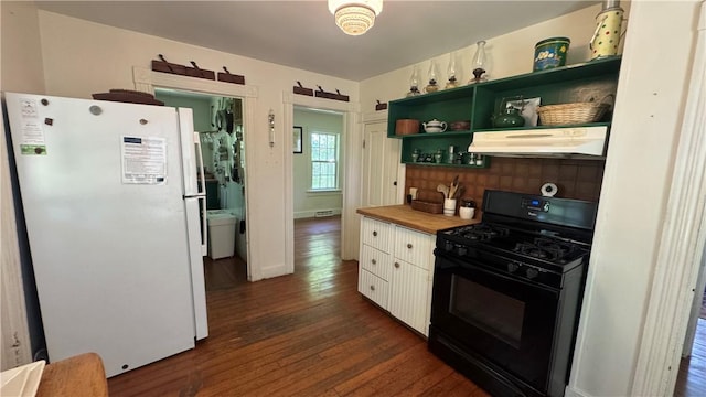 815 Beacon Hill Rd, Block Island, RI 02807 - kitchen with freestanding refrigerator, under cabinet range hood, black gas range, open shelves, and dark wood-type flooring