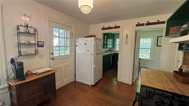 815 Beacon Hill Rd, Block Island, RI 02807 - kitchen with freestanding refrigerator, dark wood finished floors, plenty of natural light, and open shelves